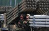 Soldiers ride a multiple rocket launcher during a military parade marking the 70th anniversary of North Korea's foundation in Pyongyang