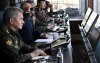 Russian President Vladimir Putin and Defence Minister Sergei Shoigu watch the Vostok-2018 war games at Tsugol military training ground in Zabaikalsky region