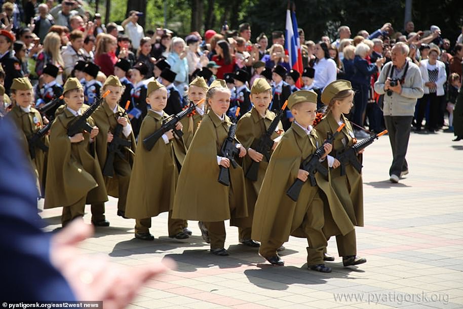 13257334-7009601-Russian_children_are_being_dressed_in_military_uniform_and_taugh-a-20_1557404574186