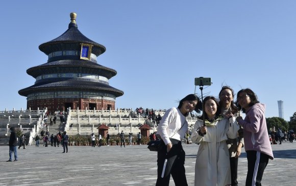Хятадын хагас тэрбум хүн “өш авах” аялалд гарчээ