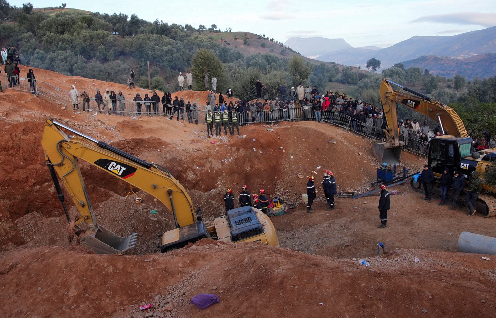 Rescuers work to reach a five-year old boy trapped in a well in the northern hill town of Chefchaouen