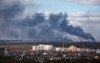FILE PHOTO: Smoke rising after shelling on the outskirts of the city is pictured from Kyiv