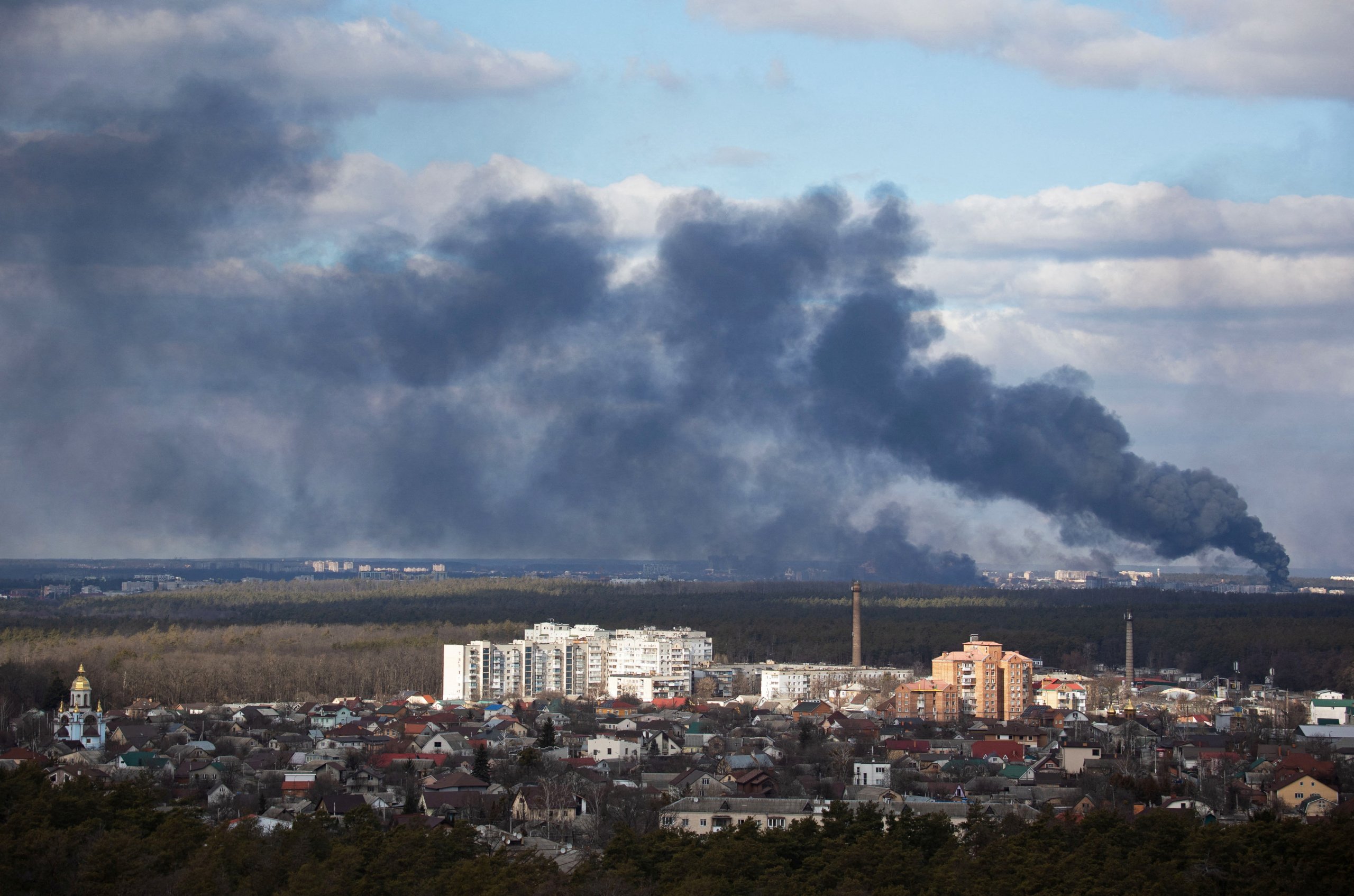 FILE PHOTO: Smoke rising after shelling on the outskirts of the city is pictured from Kyiv