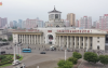kctv-aug27-8pm-news-pyongyang-station-drone-shot-slogans-935x500